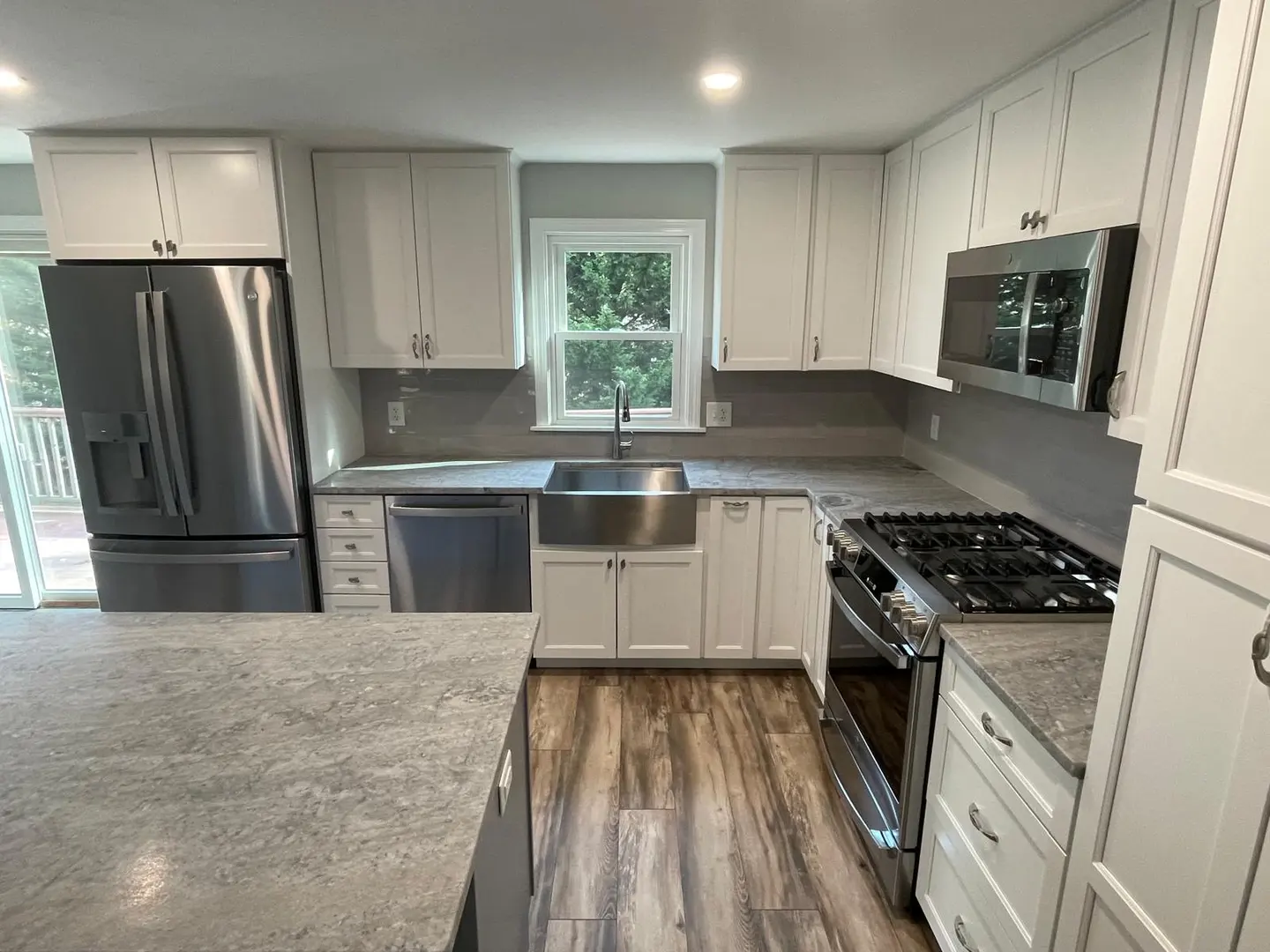 Completed kitchen cabinet installation on Cape Cod by COSTA LVM Home Service